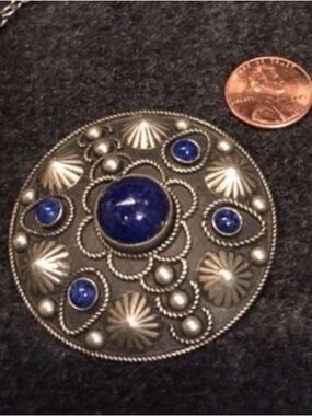 Silver antique round pin brooch.